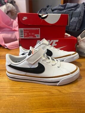 Nike Kids White Sneakers with Black Swoosh and Tan Trim